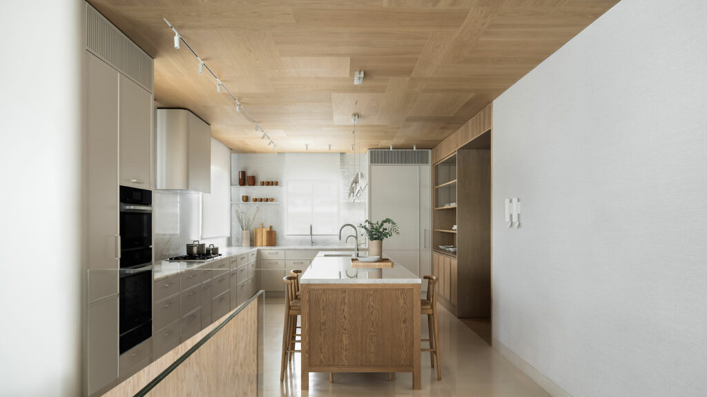 light-colored wood flooring that reaches the ceiling in the kitchen